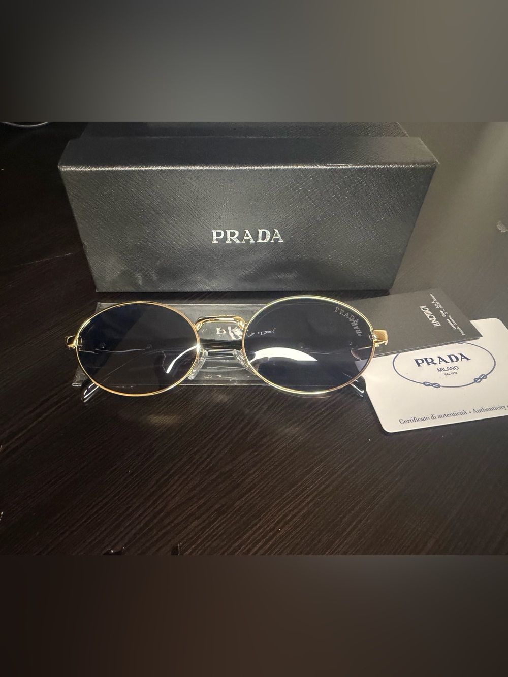 Prada Gold Frame Sunglasses with Black Lenses